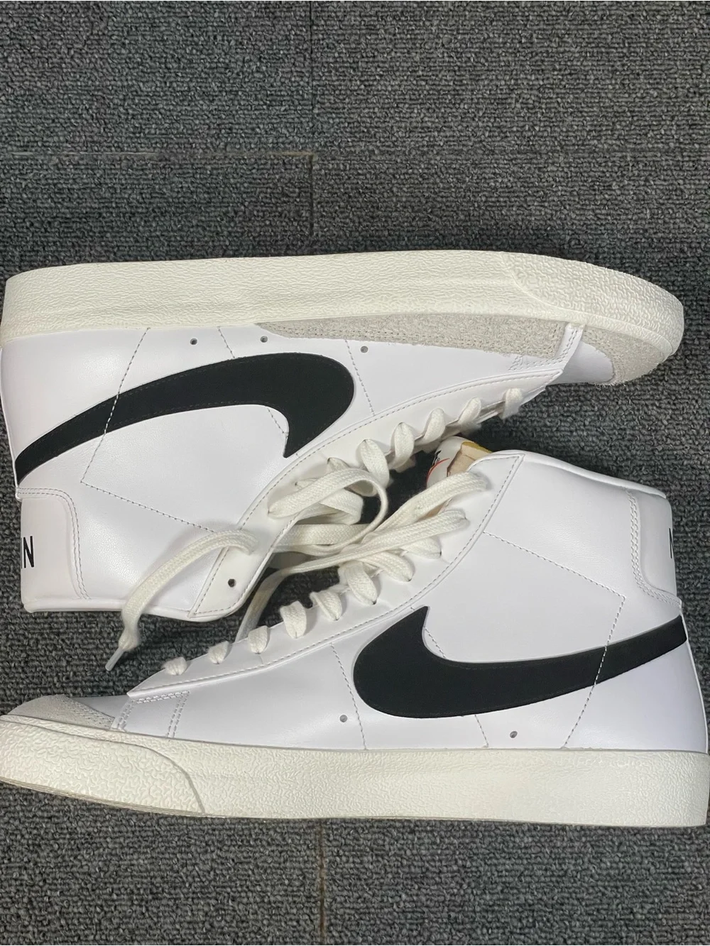 Men’s Nike White High-Top Sneakers with Black Swoosh